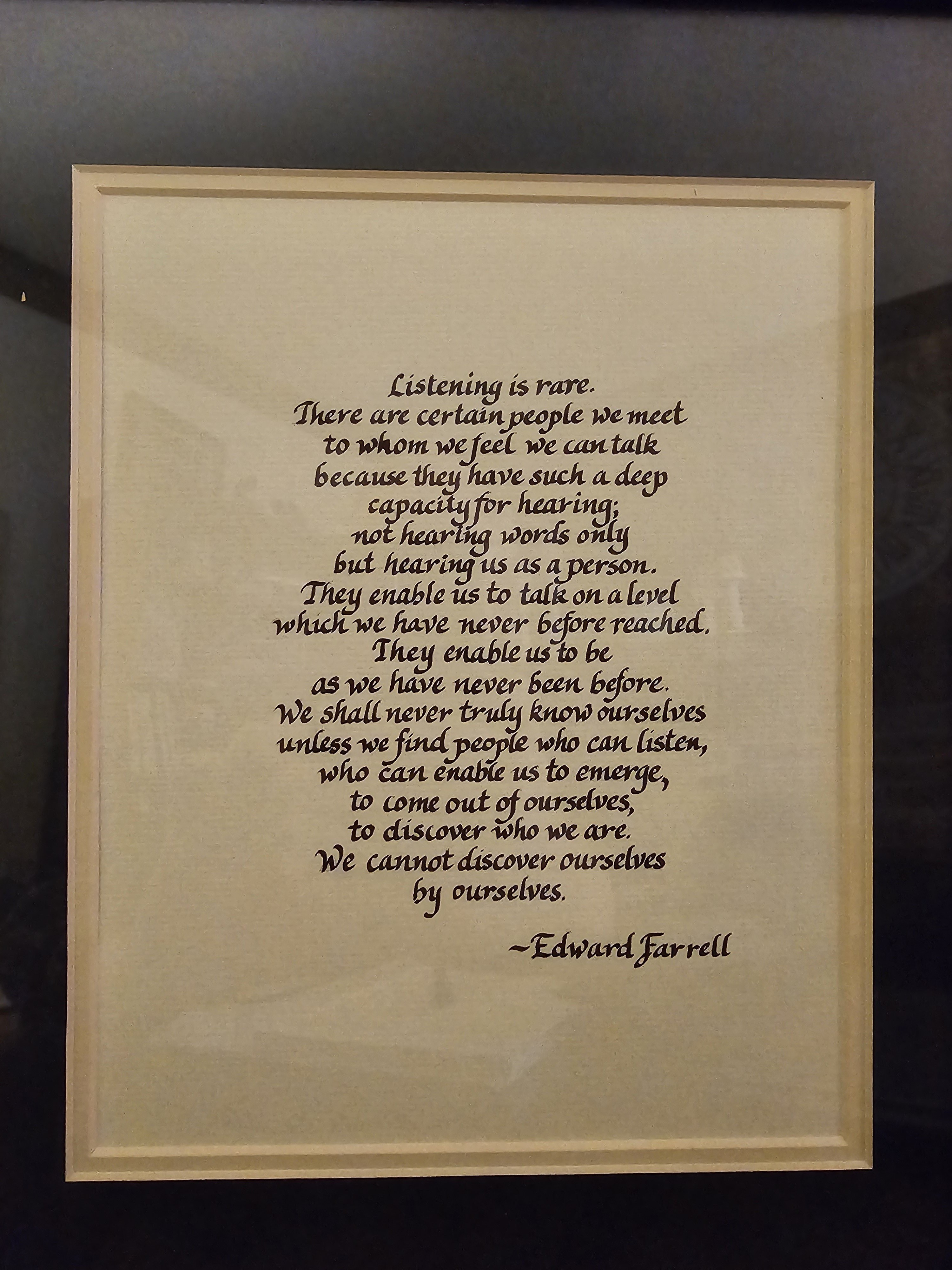 A framed Edward Farrell quote about listening, hanging in Jef&rsquo;s office