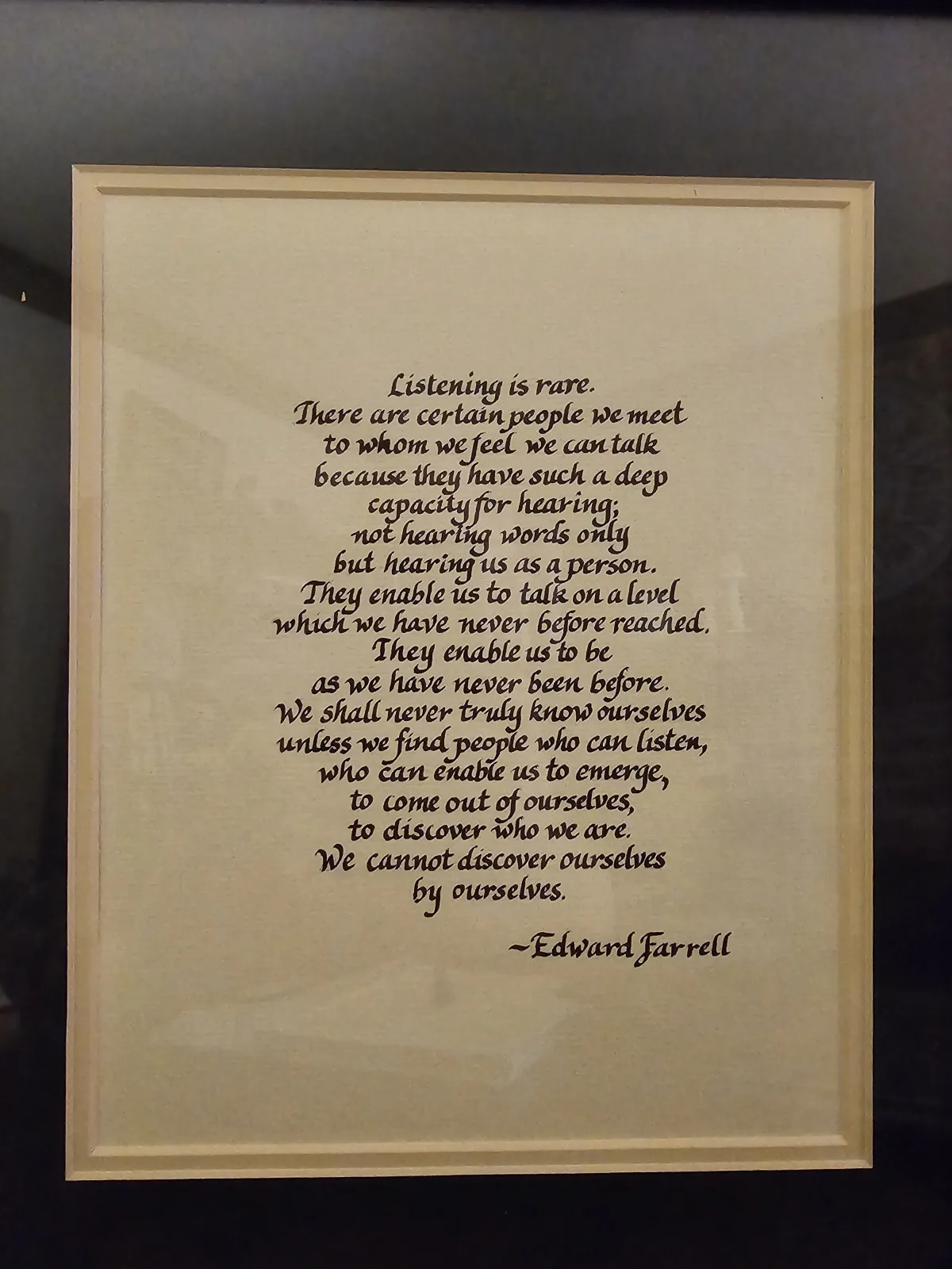 A framed Edward Farrell quote about listening, hanging in Jef&rsquo;s office